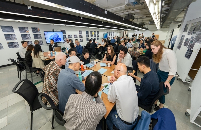 Attendees discussing at worktablesjpg
