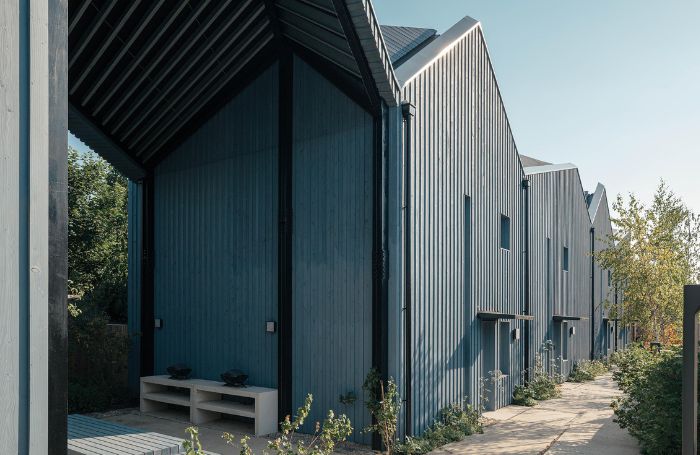 Sustainble netzero teal coloured housesjpg