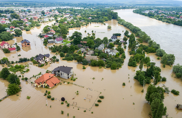 Aerial view of a flooded area with houses and trees partially under water 700jpg