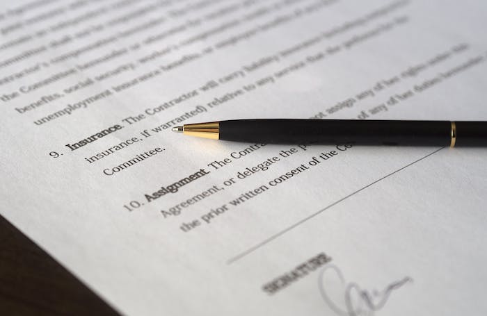 An insurance contract on paper and a pen LARGEjpg