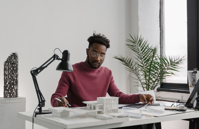 Architect sitting behind a desk working LARGEjpg