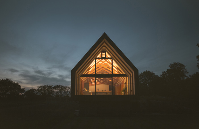 Black Barn of modern Suffolk vernacular light up at nightjpg
