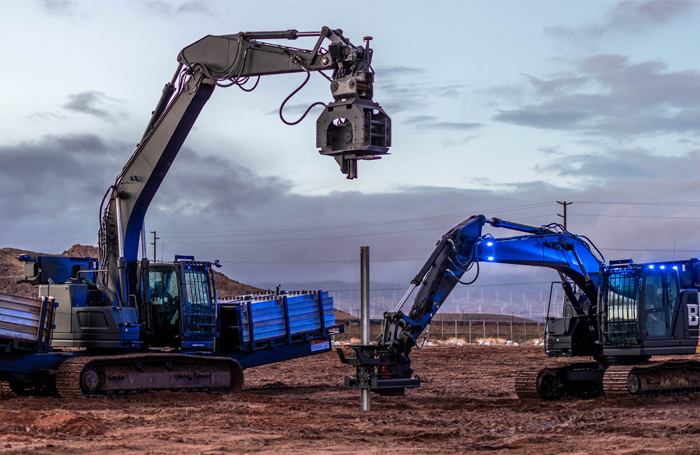 Blue autonomous excavators digging 700jpg