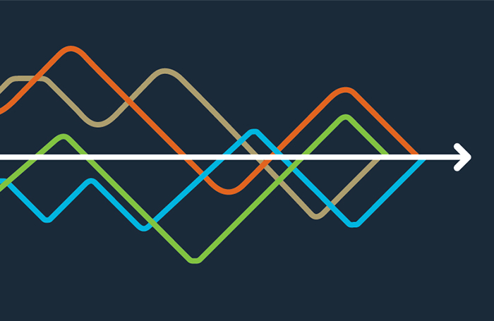 Multicoloured graph lines and white arrow on navy backgroundjpg