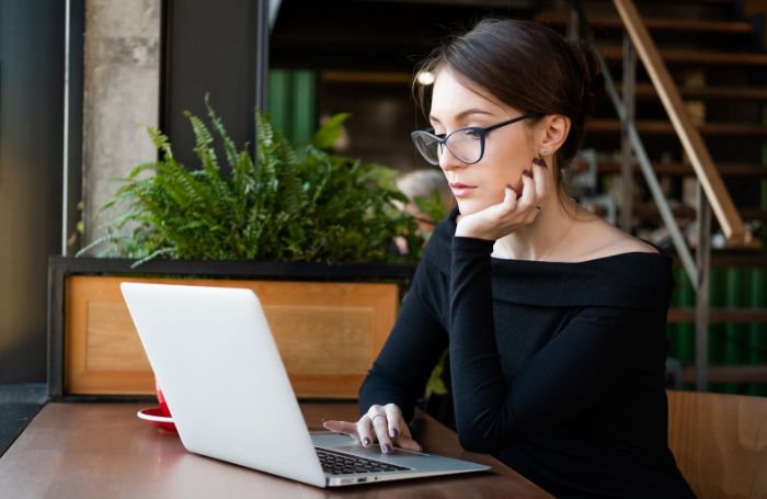 Person watching a laptop in an office LARGEjpg