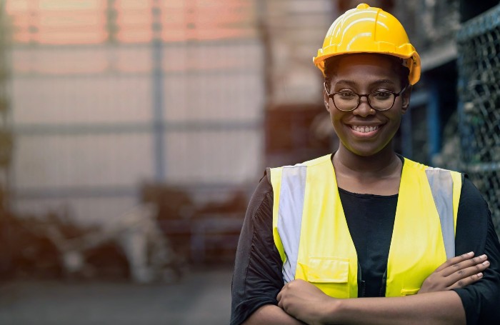 Promo image 2GCImage 1jpg Woman in hi-viz arms folded and smiling