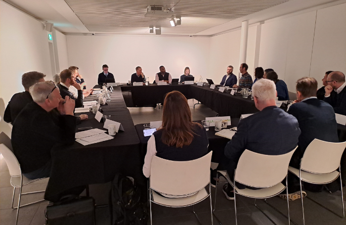 RIBA members seated at the Creative Industries roundtable at RIBA North png A large set up boardroom style with people seated around.