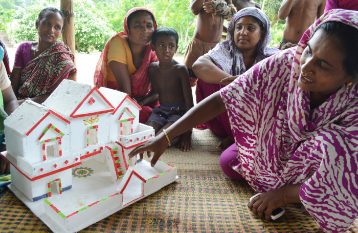 Women and children at cocreation session 700x455png Women and children at cocreation session