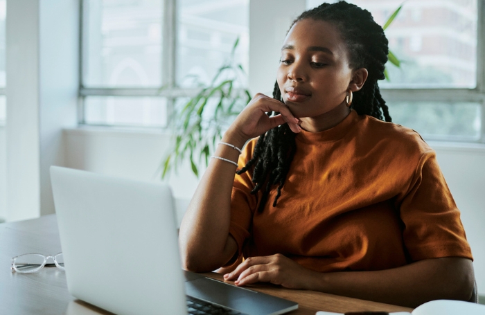 Young woman working at a laptop GC LARGEjpg
