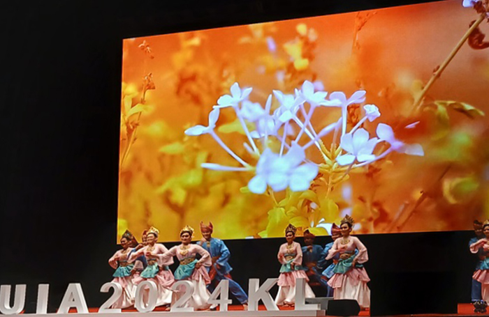 uia opening ceremony dancers with flower motif co e meunierjpg