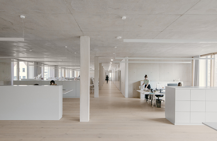 Jacoby Studios white interior space with storage and desk spacejpg
