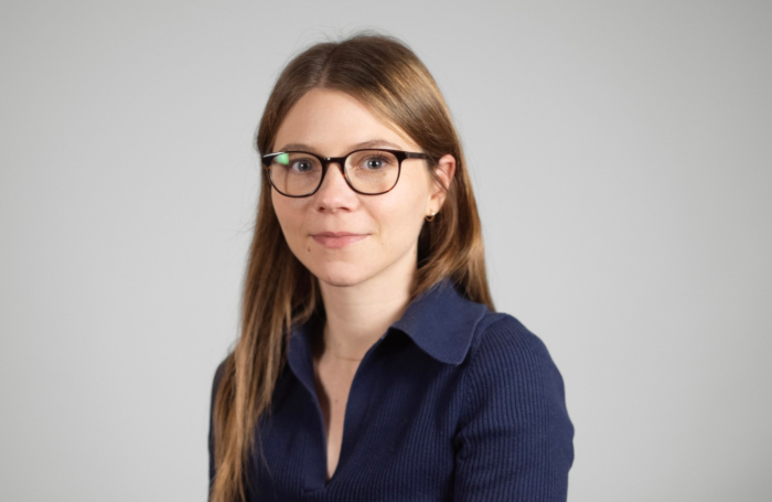 JennyHainesjpg Portrait of woman smiling wearing glasses