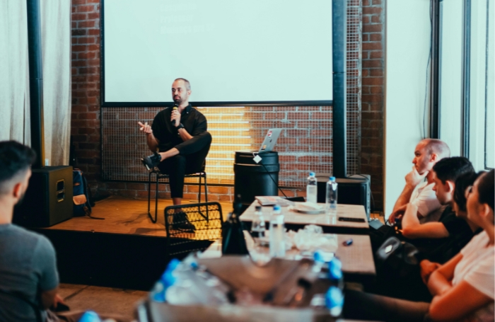 A speaker addresses a crowd during a talkjpg