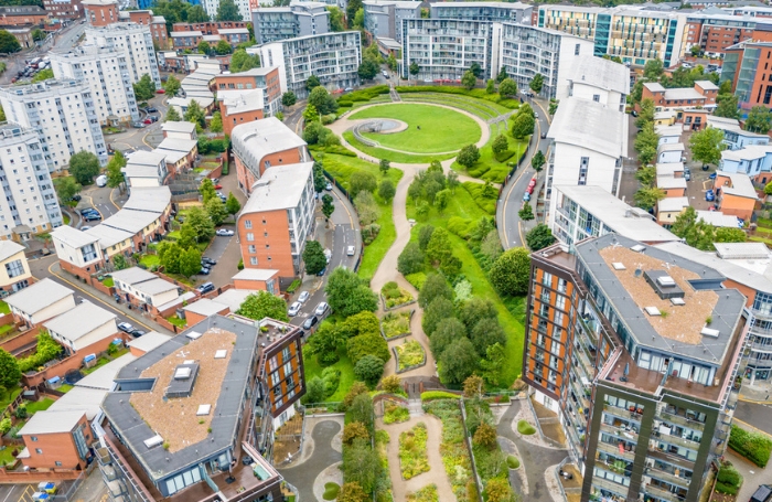 Aerial shot of a modern housing community with a green space in the middlejpg