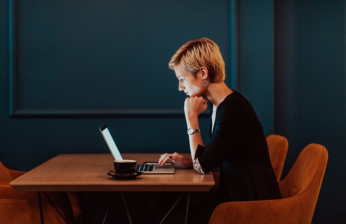 An architect looking at a laptop seeing why email is the weakest security link 700x455jpg
