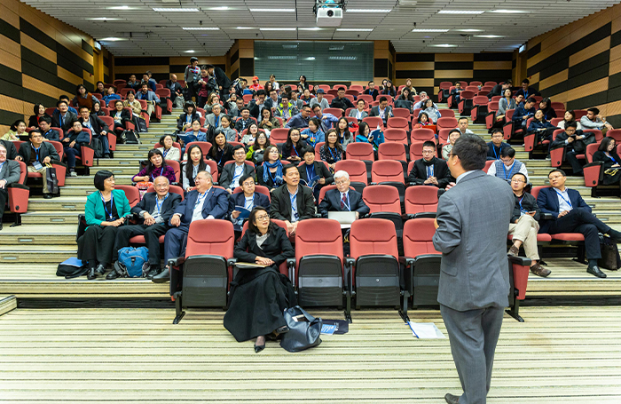 Conference attendees in an auditoriumjpg