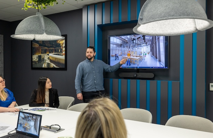Man pointing at presentation screen EDI Toolkitjpg Man pointing at presentation screen
