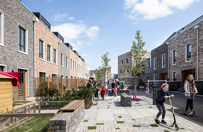 Modern terraced house street with kids playing 700jpg