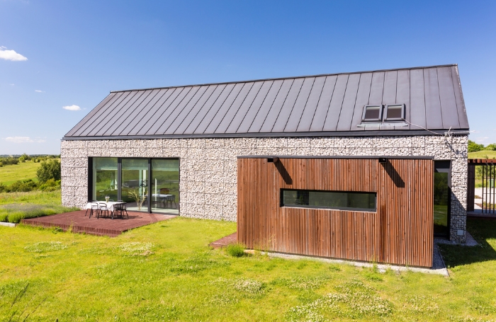 Single storey modern house with blue sky in the background GC LARGEjpg Single storey modern house with blue sky in the background