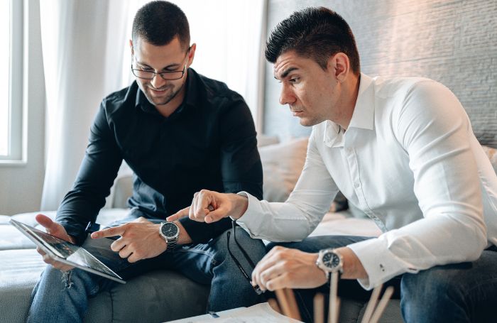 Two architects discussing a topic in an officejpg