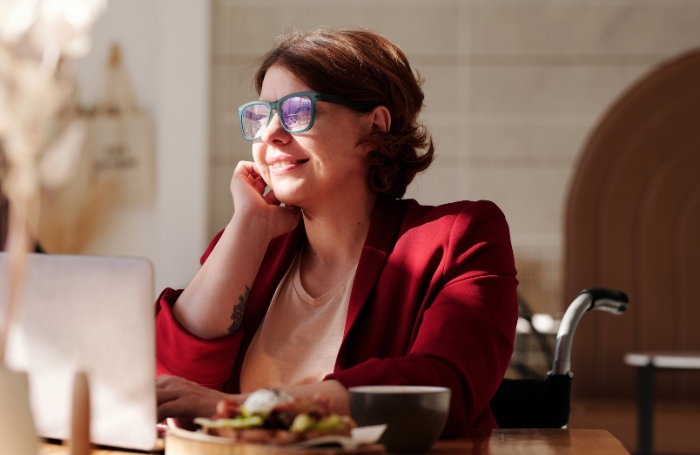 Woman in cafe while working on a laptop LARGEjpg