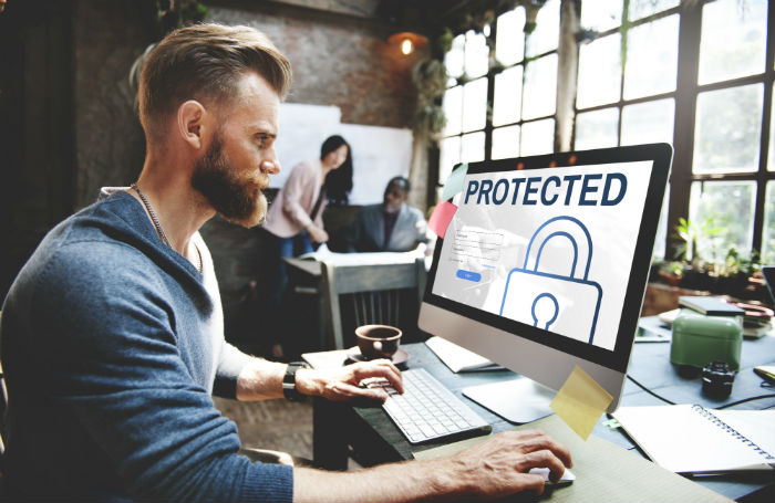 Worker looking at his protected computer700x455jpg