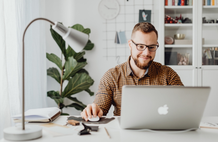 man working on a laptop in an office LARGEjpg