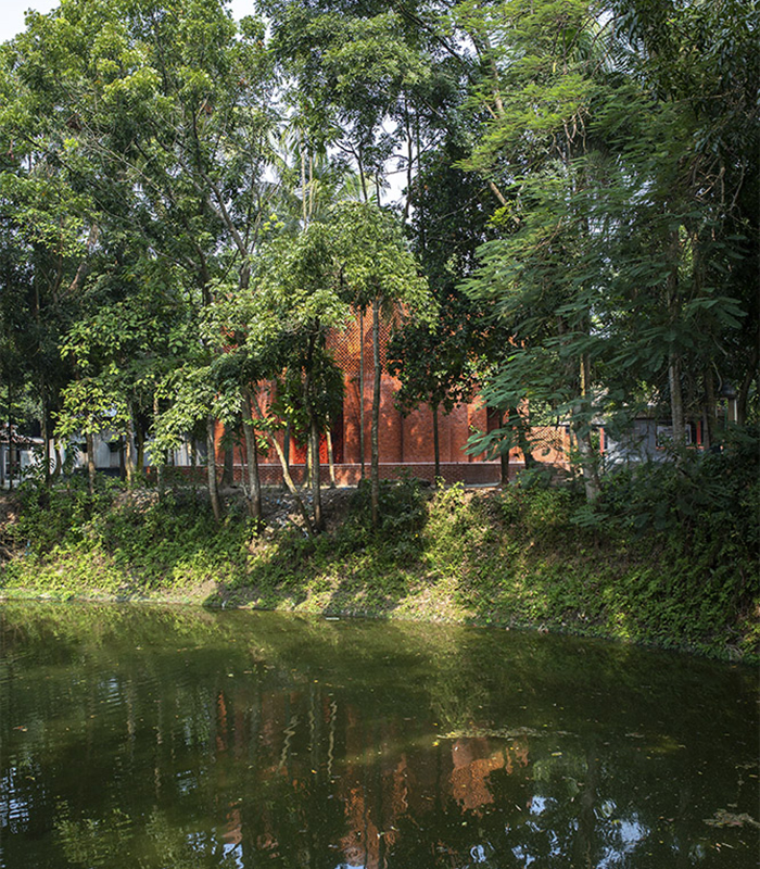Shah Muhammad Mohsin Khan Mausoleum viewed from a river and surrounded by treesjpg