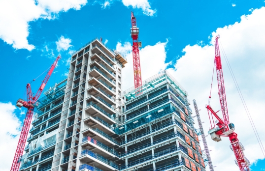 A group of highrise buildings on a construction site