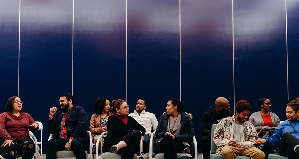 Group of people sitting in an audience 