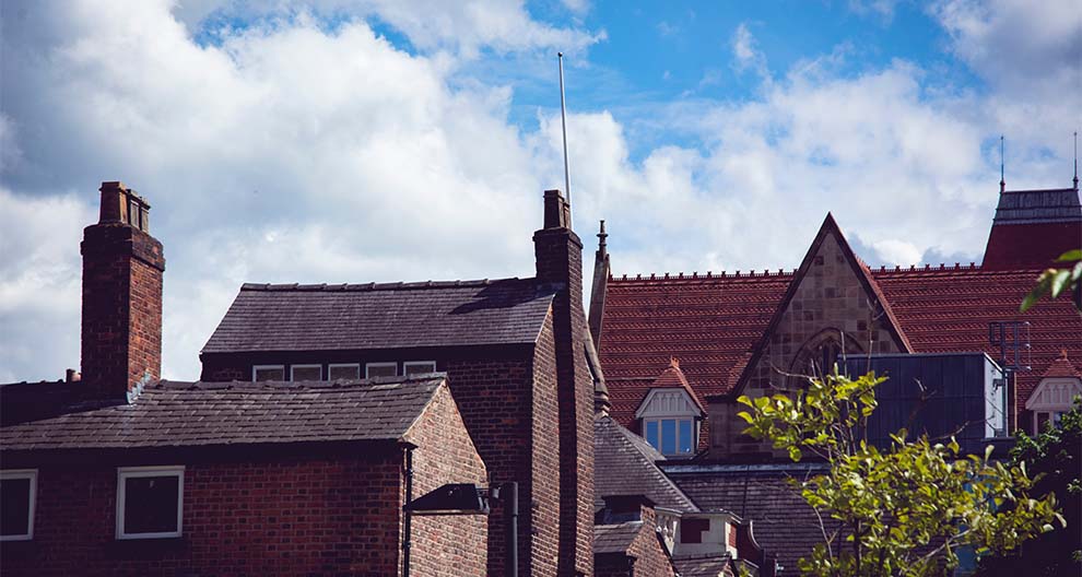 View of stone buildings with tile roof tops