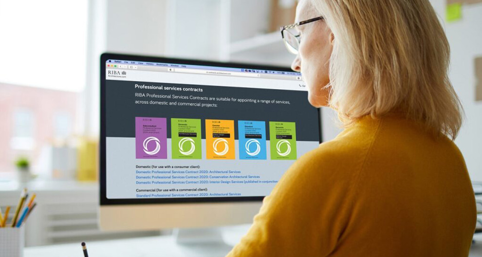 Woman at computer screen viewing digital contracts